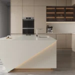 Caesarstone Quartz 4600 Organic White surface in Modern minimalist kitchen with sleek cabinetry, geometric island, bar stools, built-in appliances, and natural light.