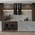 Caesarstone Quartz 5031 Statuario Maximus surface in Modern kitchen with marble countertops, dark wood cabinetry, two black stools, and two pendant lights.