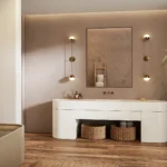Caesarstone ICON 5141 Frosty Carrina in Modern bathroom with a sleek bathtub, double sink, large mirror, and potted plant.