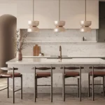 Caesarstone ICON 5143 White Attica in Modern kitchen with marble island, four stools, pendant lights, green cabinets, and wooden flooring.