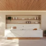 Minimalist outdoor kitchen with marble countertop, wooden shelves, plants, and a swimming pool nearby.